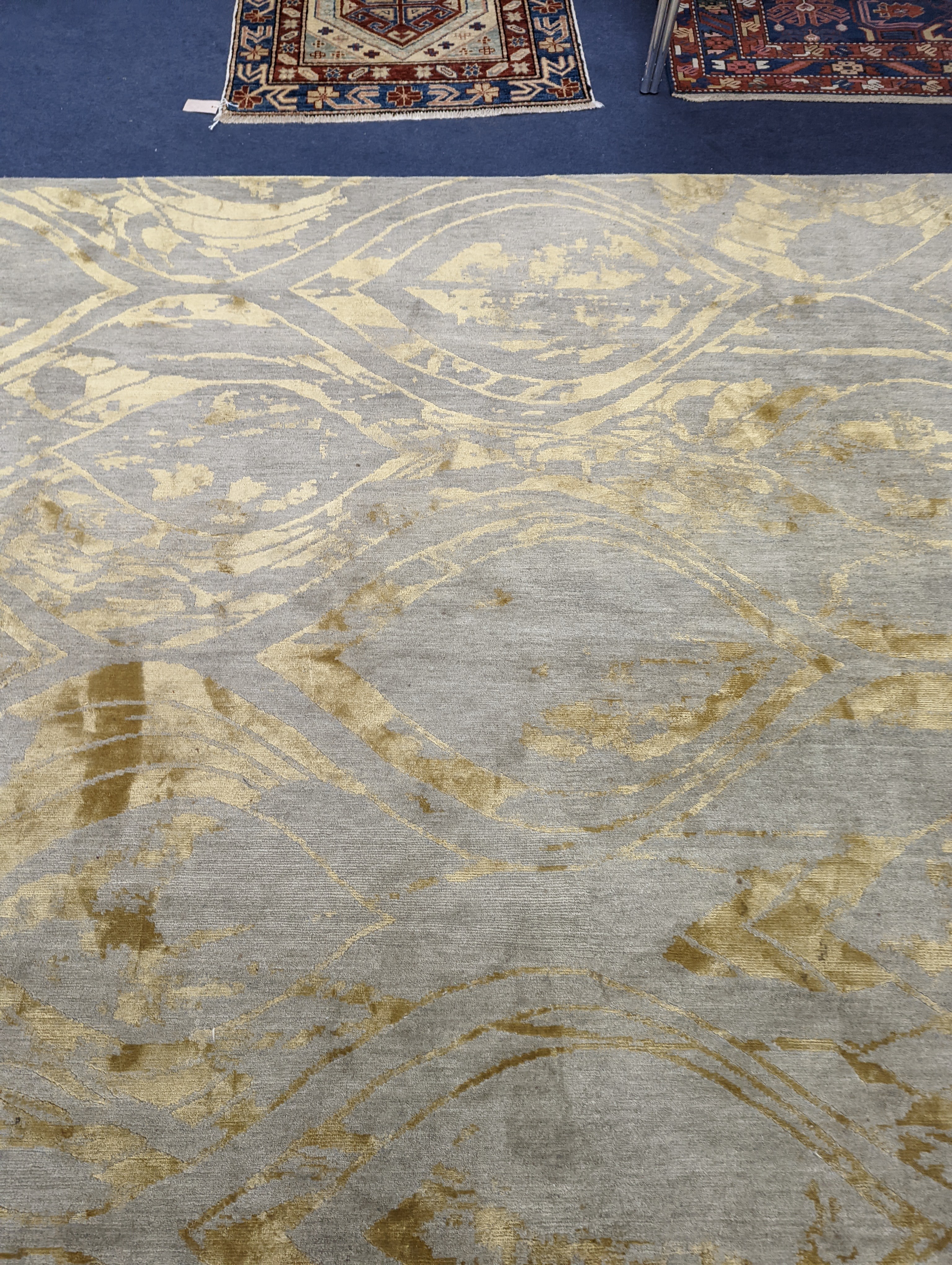 A contemporary 'Son' Nepalese wool and silk stone grey and gold carpet, 490 x 270cm